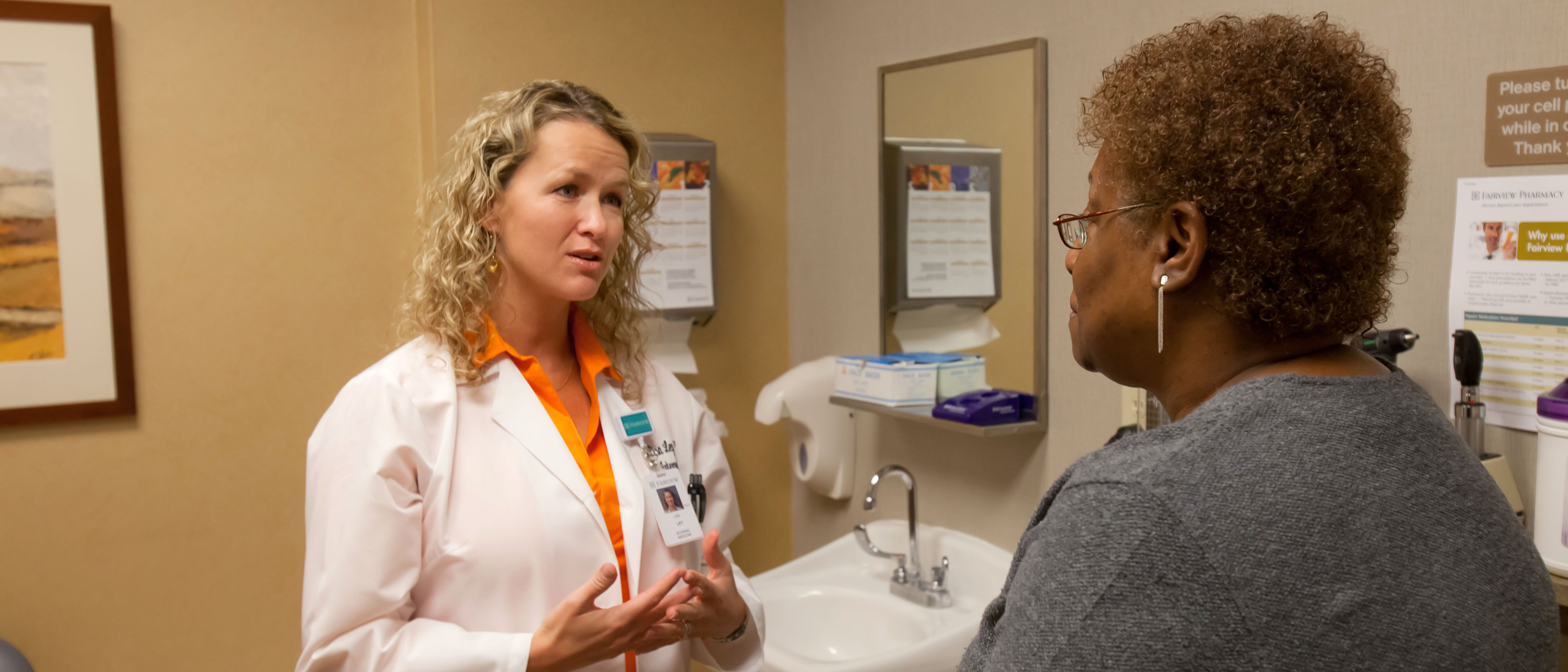 Doctor and patient go over paperwork for insurance marketplace