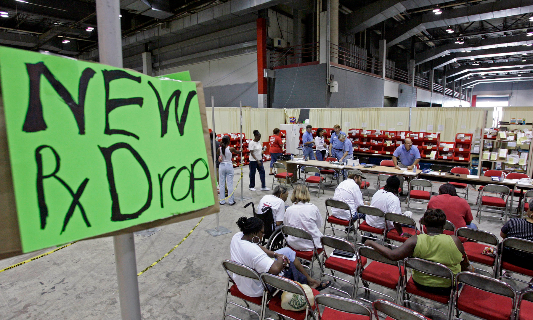 In the aftermath of Katrina, evacuees wait for their prescriptions to be filled as CVS Pharmacy sets up 24 hour service for evacuees from New Orleans at Reliant Arena on September 9, 2005 in Houston, Texas.