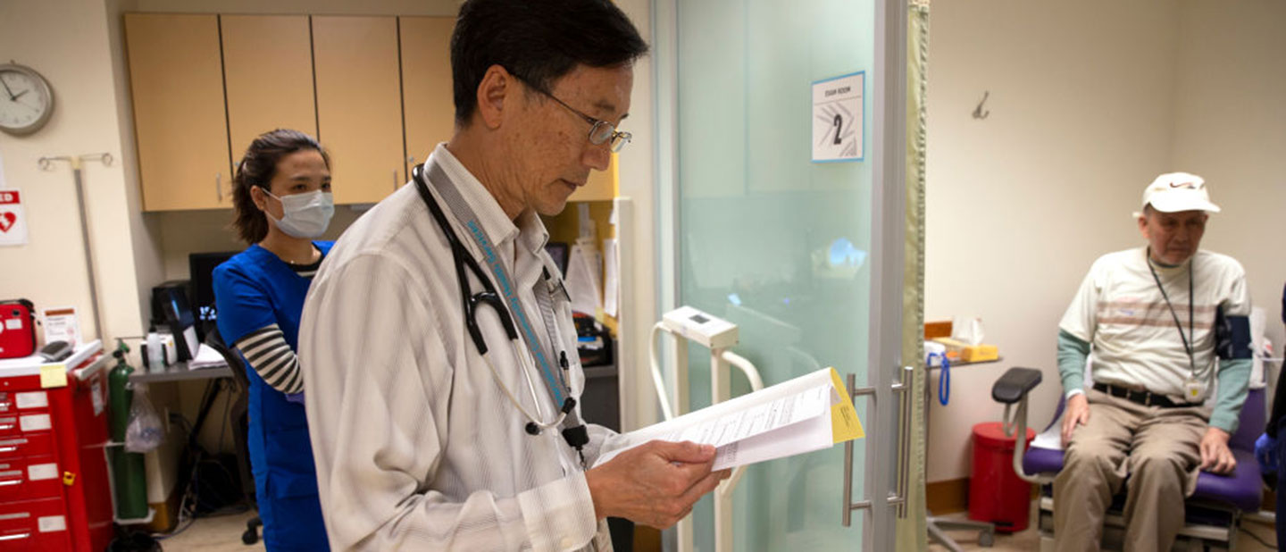 Doctor treating patient with COVID-19
