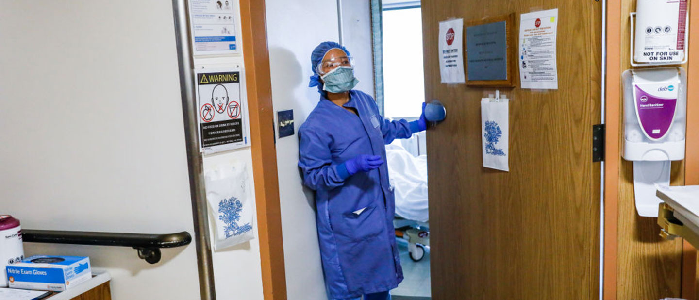 nurse caring for COVID-19 patient