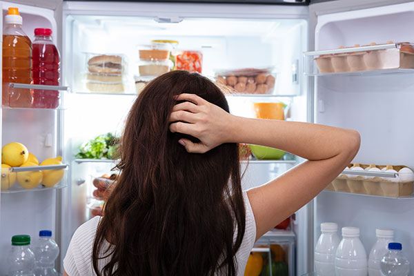 staring into refrigerator