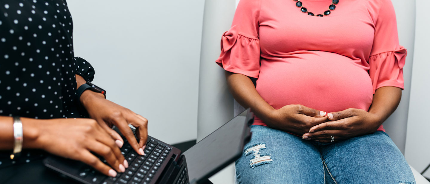 black pregnant woman getting doctor checkup_21x9 black pregnant woman getting doctor checkup