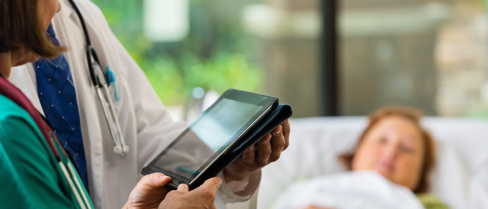 Doctors use electronic health records with patient