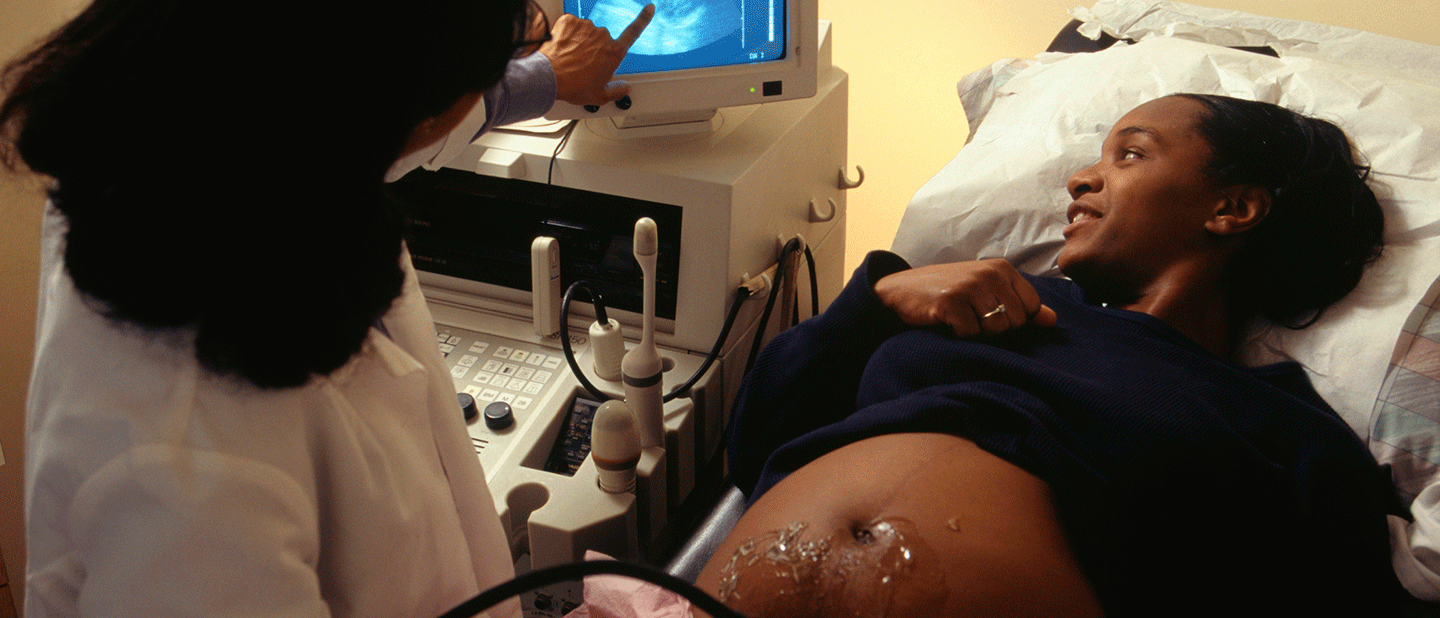 woman getting ultrasound while pregnant