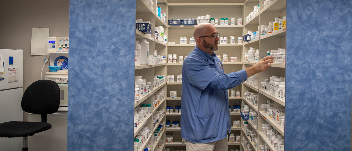 pharmacist choosing medications for patient