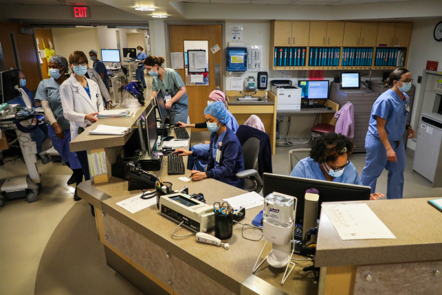 Boston Medical Center nurses and doctors orchestrate care for patients on April 15, 2020. Officials interviewed in Massachusetts and 10 other states said that hospital spending, particularly in the form of high prices, is a key driver of rising health care costs. Photo: Erin Clark/Boston Globe via Getty Images