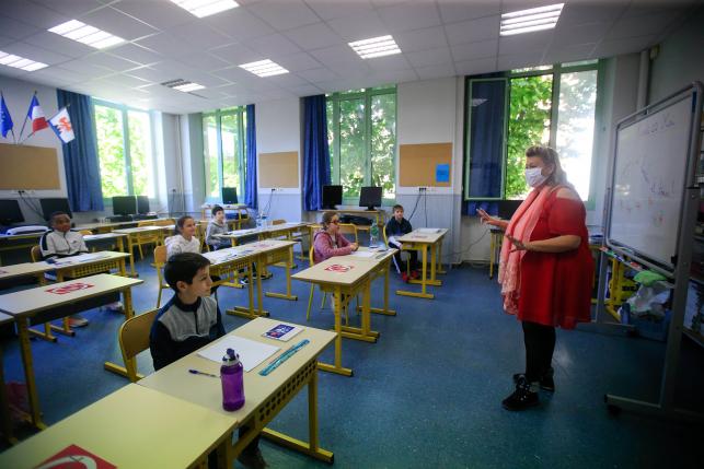 School children attend a class at the Simone Veil Primary School in Nice, France, May 12, 2020.