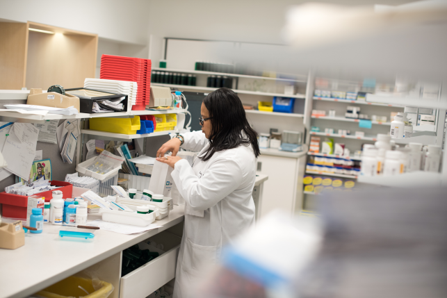 Pharmacy manager Latoya Ross f​ills a prescription order for ​a patient in East​ Cleveland, Ohio. Ohio is one of seven states with a prescription drug affordability board established to rein in drug costs.