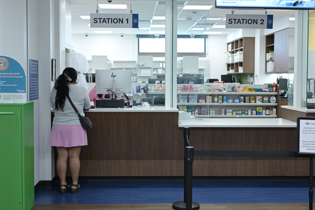 Woman at pharmacy counter