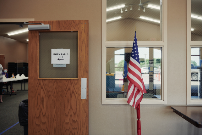  An American flag stands on display at a polling location in Sioux Falls, S.D., on Tuesday, June 2, 2020. Residents of South Dakota, one of 12 states that have not yet expanded Medicaid eligibility under the Affordable Care Act, will vote on expansion in the November midterm elections. Photo: Dan Brouillette/Bloomberg via Getty Images