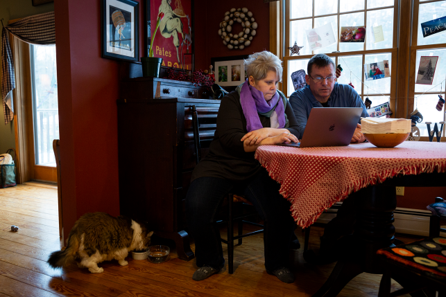 Couple at table with laptop