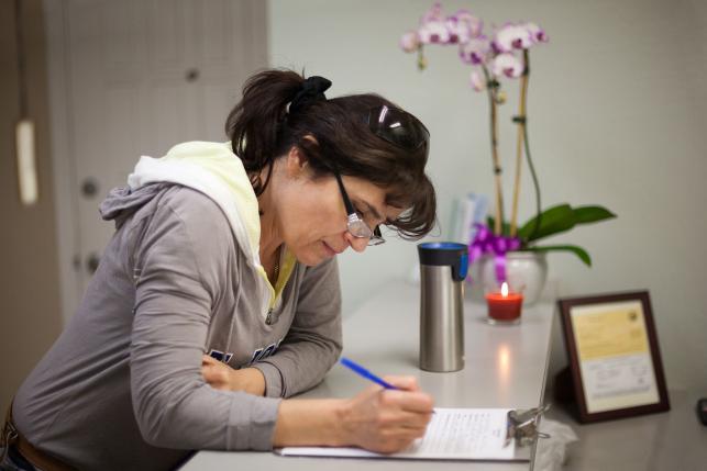 Woman reviewing health insurance documents