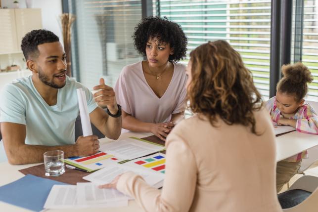 Consumer discussing health insurance choices with an agent