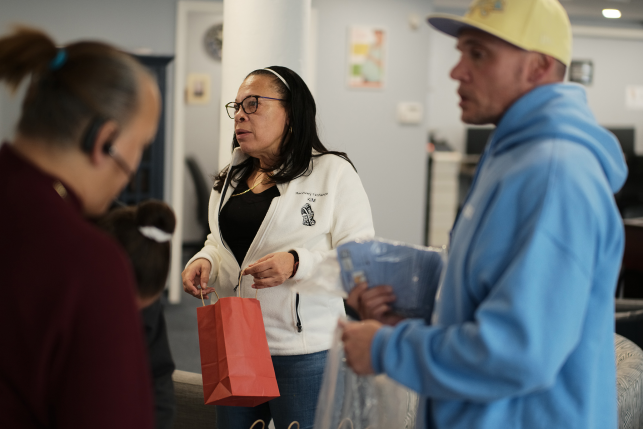 Adults assembling hope bags for high-risk youth