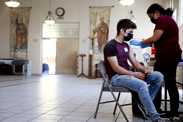 Person receiving COVID-19 vaccine injection