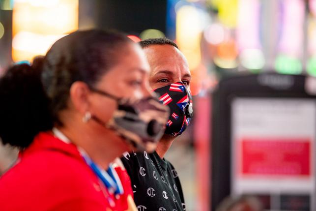 Puerto Rican New Yorkers wearing masks in Times Square New York