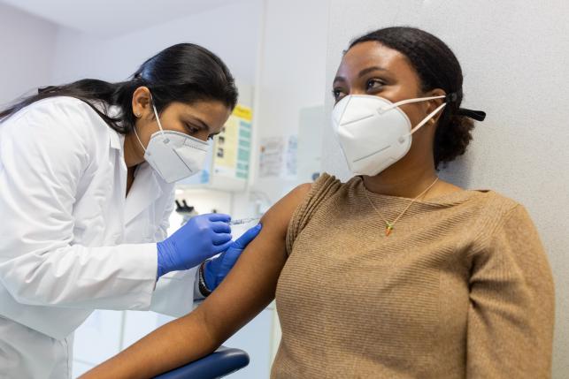 patient getting COVID vaccine from their primary care physician