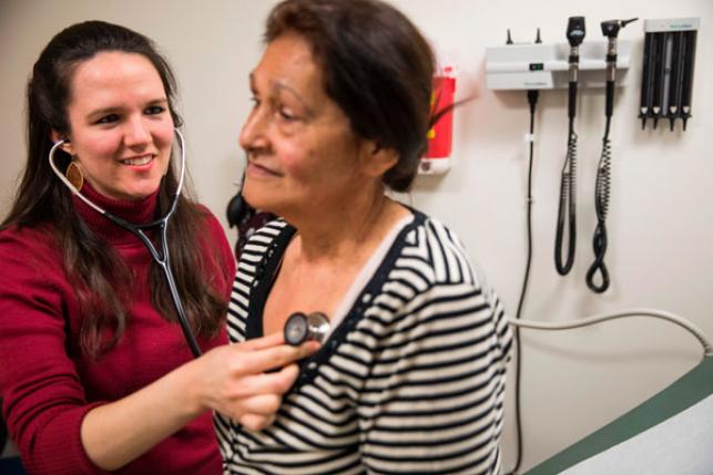 Nurse Katie Baker examines patient Mildred Arce at the Esperanza Health Center in Philadelphia, PA, on March 13, 2017. The center is located in North Philadelphia, the city with the highest rate of deep poverty people with incomes below half of the poverty line of any of the USAs 10 most populous cities, were a high rate of people do not have medical insurance coverage. DOMINICK REUTER/AFP via Getty Images