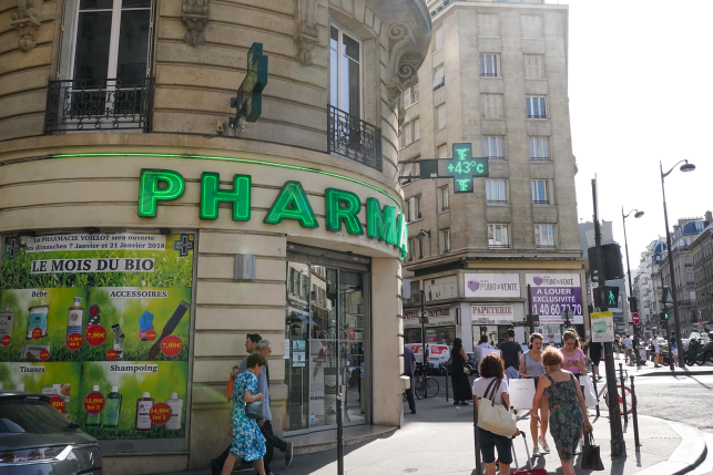 Image, view of pharmacy with people outside