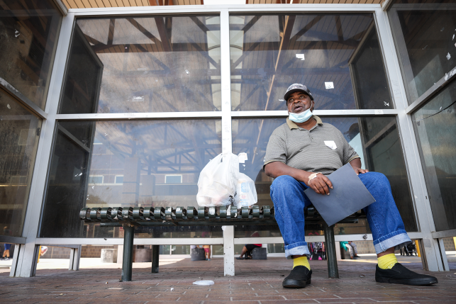 Man sits on bench