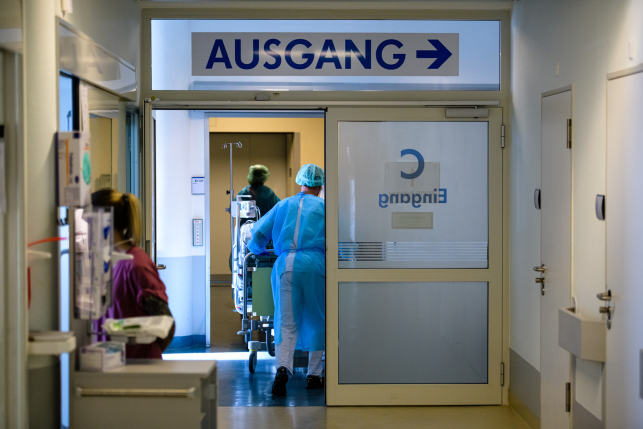 A doctor and nurses tend to a patient at University Hospital Leipzig on Nov. 18, 2021, in Leipzig, Germany. Germany spends less on health care per capita than the U.S., yet life expectancy at birth is nearly four years higher. Photo: Jens Schlueter/Getty Images