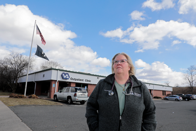 Doctor stands in front of VA clinic