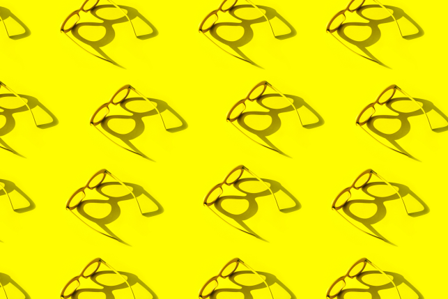Stylized image of glasses on a yellow background