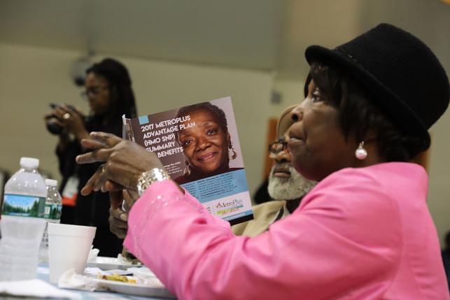 Photo, woman holding Medicare brochure