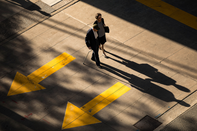 Elderly couple walks on street