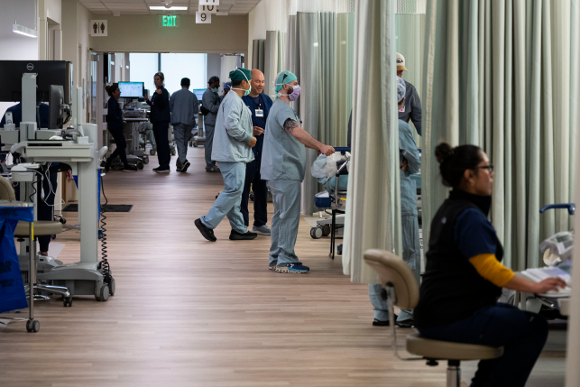 Surgeons prepare for surgery in the hallways of a clinic