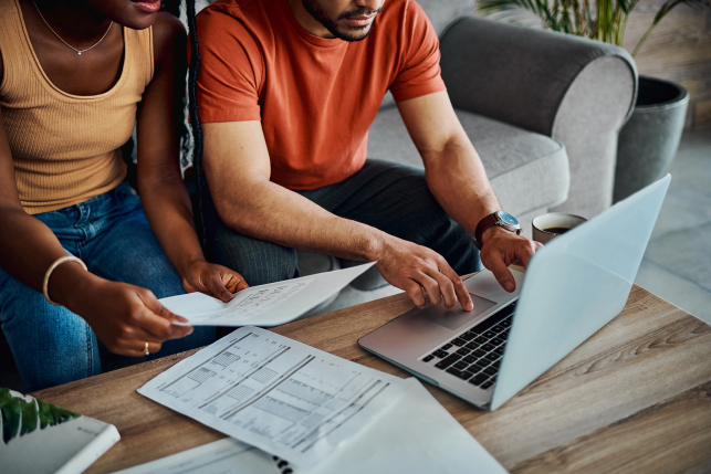 Couple sits at computer