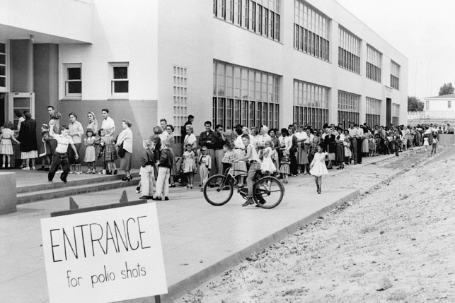 First and second graders at the Kit Carson School in San Diego line up for Salk Polio vaccine shots on April 16, 1955.