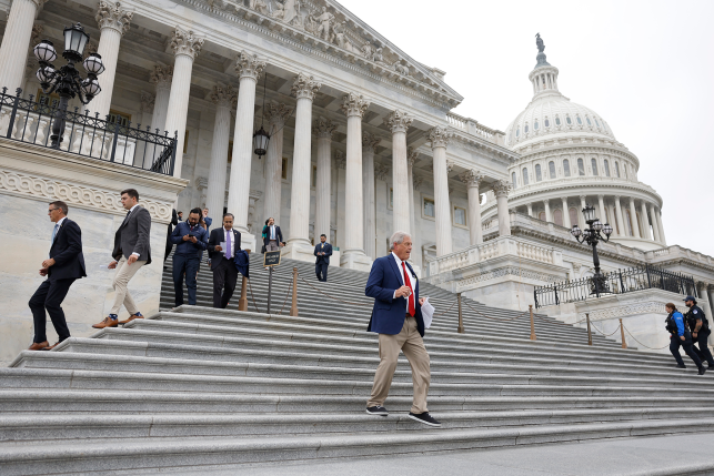 House members walk down steps of U.S. Capitol building