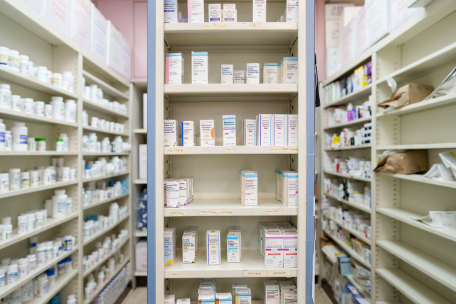 Shelves of pharmacy stocked with medication