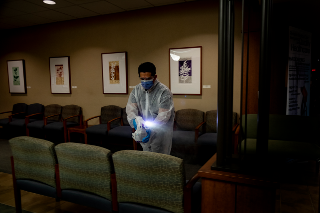 Octoclean worker Erick Borjas uses electrostatic disinfectant (ESD) to clean and rid a waiting room of COVID-19 during the coronavirus pandemic at a medical facility on April 15, 2020 in Riverside County, California. 