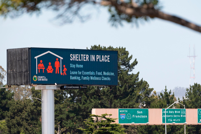 A billboard instructing people to shelter in place is seen along Interstate