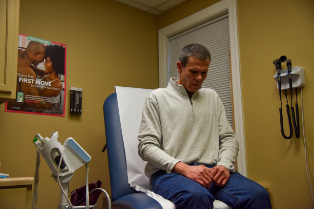 Photo, man sits on medical bed