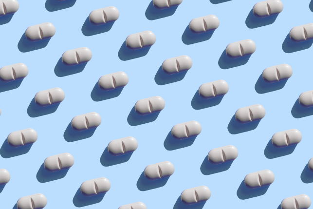 Repeated pills on the blue background