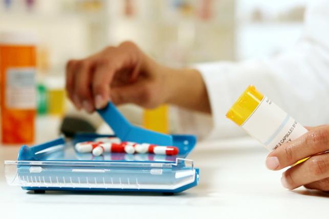pharmacist separates drugs