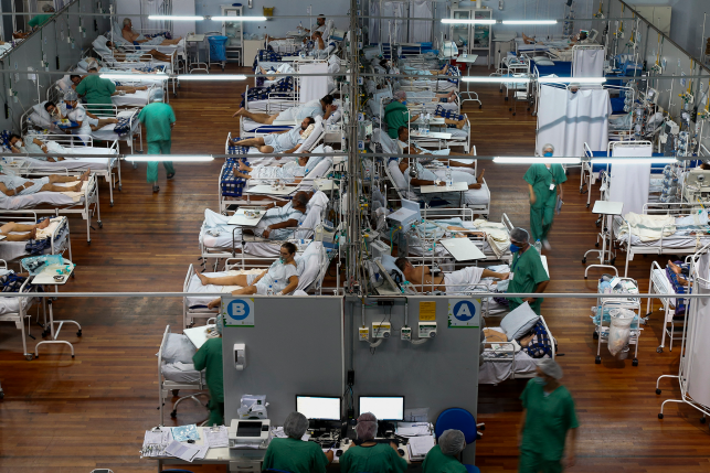Patients affected by the COVID-19 coronavirus remain at a field hospital set up at a sports gym, in Santo Andre, Sao Paulo state, Brazil, on March 26, 2021.