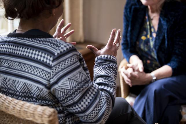 Woman speaking with her mental health provider