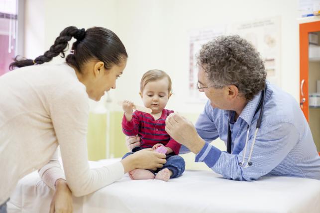 baby at pediatrician getting health checkup