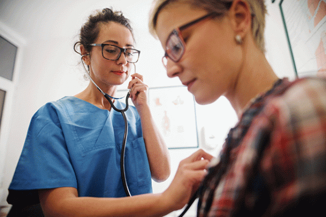 doctor examining Medicaid patient