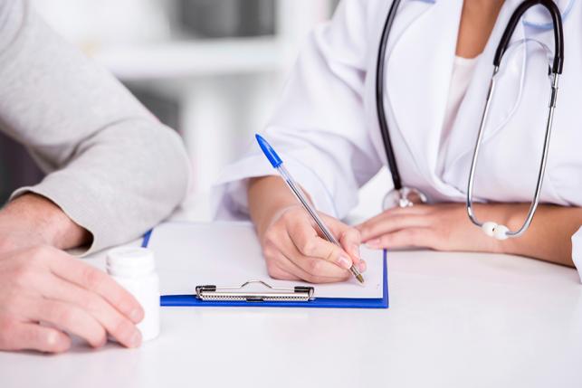signing 529190907 1024x620 savedforweb doctor patient hospital health care