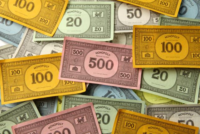 monopoly-money-representing-high-drug-costs Monopoly money representing high drug costs
