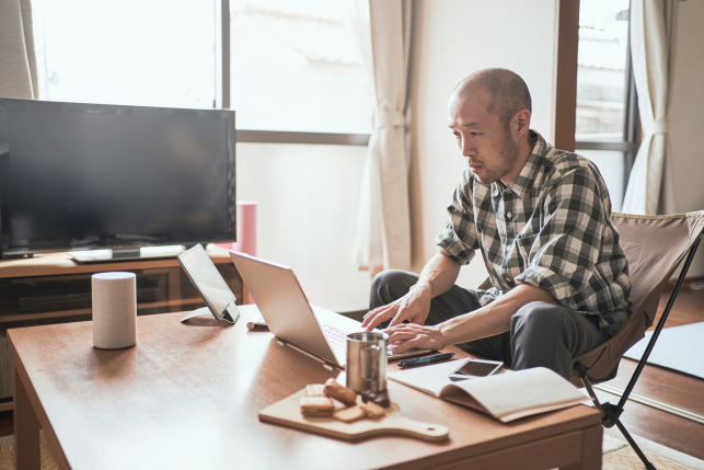 man looks at computer