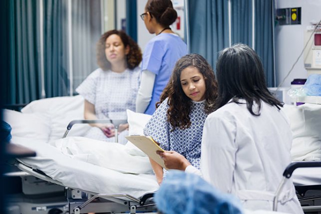 patient in hospital talking to doctor