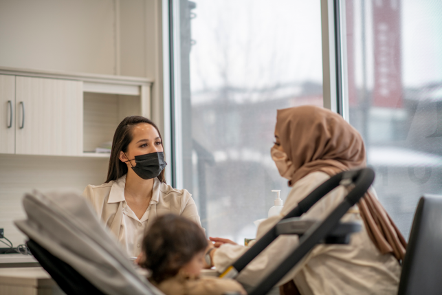 primary care doctor talks to patient