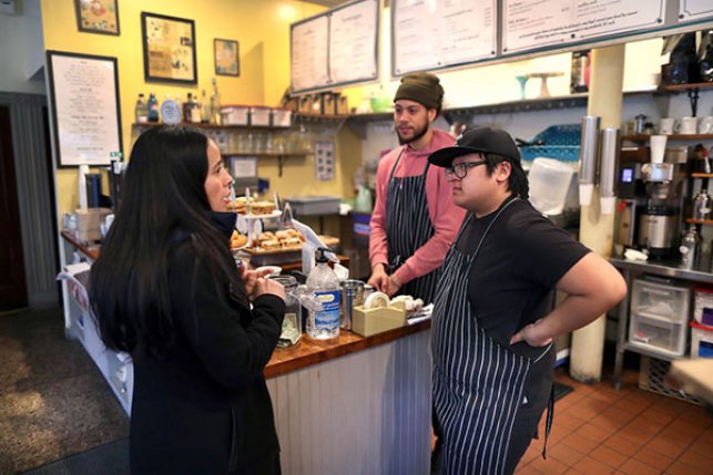 small business employees talk to customer