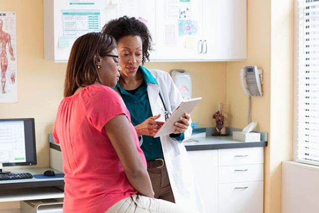 patient talking to doctor about insurance